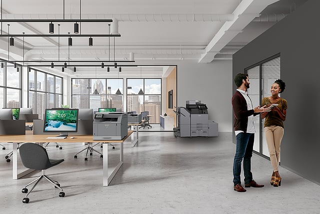Copier Leasing in Houston: What to Consider Before You Lease White and gray industrial style open space office interior with coworking and glass board room gray wall with window. Corner of stylish white industrial style office interior with glass wall meeting room and rows of desks. Space for education and business with hot desks. Gray wall with window. 3d rendering